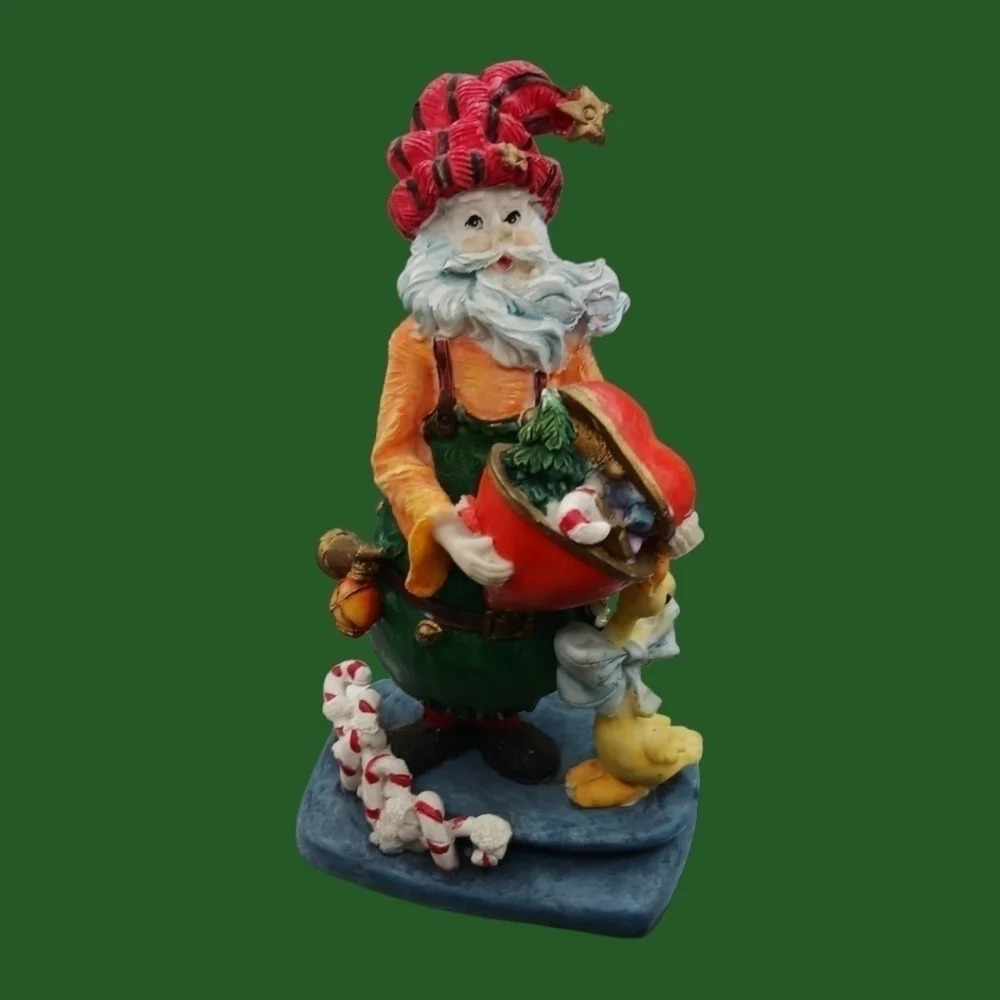 Santa claus figurine with gift and duck